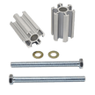 A set of silver-colored aluminum bump stop relocation brackets along with longer bolts for installation.