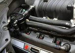 J&L Oil Separator 3.0 Passenger Side, Black Anodized installed in a car- S&B