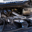 Close-up of an S&B Filters Cold Side Intercooler Pipe for 2023-2025 Ford Powerstroke F-450 / F-550 6.7L - installed in a car