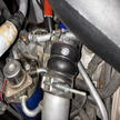 Close-up of an SB Filters Hot and Cold Side Boot Kit For 2004.5-2005 Chevy / GMC Duramax 6.6L (LLY) on a vehicle's engine bay.