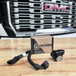 SB Map sensor spacer and its packaging in front of a GMC vehicle grille.