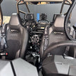 Close-up of the interior of a Polaris RZR vehicle with an SB Helmet Pumper with particle separator technology