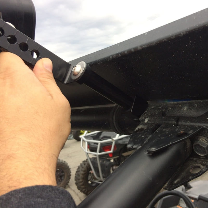 Hand adjusting a black S&B 3